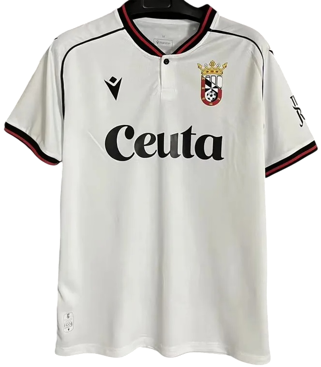 Camisa I AD Ceuta 2026 2027 Macron oficial 